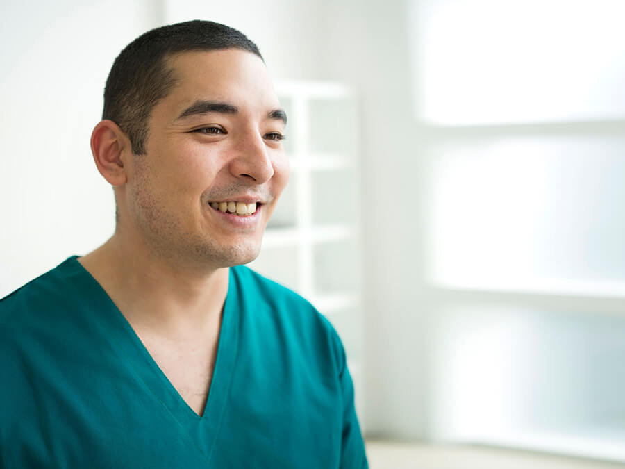 Smiling surgeon at clinic