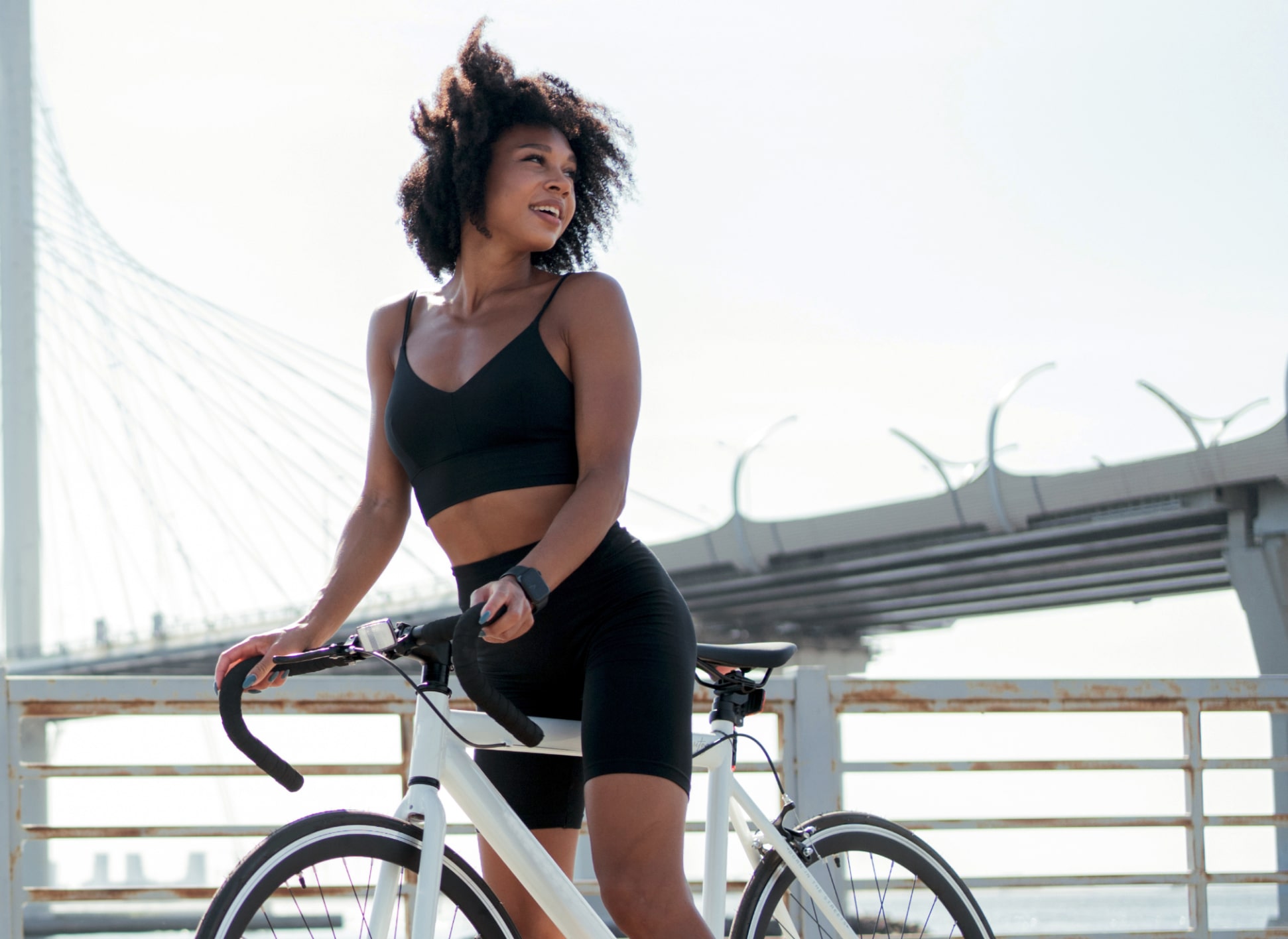 woman exercising on her bike and enjoying the day